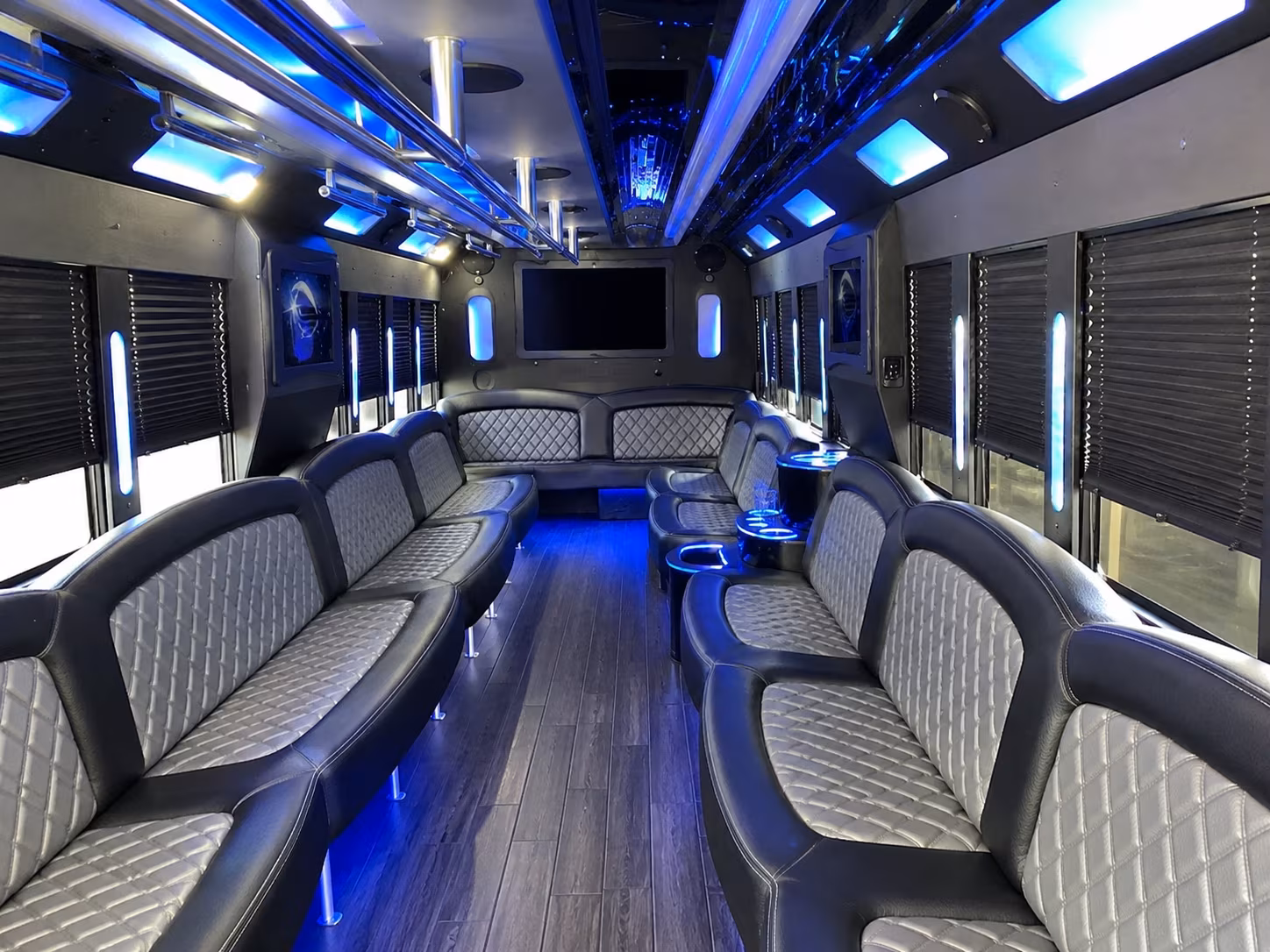 Friends laughing during a party bus celebration in New York